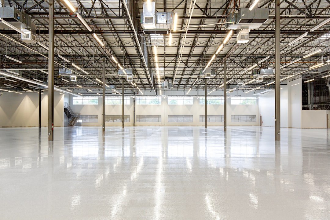 High-angle perspective of a 67,000 sq. ft. industrial facility featuring a precision-installed ESD epoxy flooring system in Houston, TX. This imagery documents large-scale infrastructure designed for mission-critical environments and the energy-to-compute (E2C) sector. For technical specifications and case studies on this installation, visit: https://craftsmanconcretefloors.com/esd-flooring/